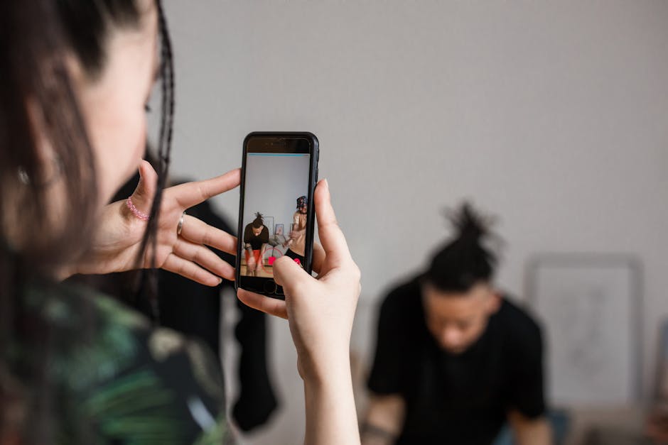 Creator recording a vertical video clip in a bright studio